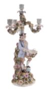 A German four-light candelabra, probably Sitzendorf in the form of a gallant holding a basket,