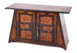A late Victorian or Edwardian stencilled table cabinet in Art Nouveau taste,