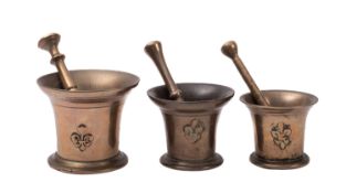 A William & Mary polished bell metal mortar, circa 1690; the flared rim with decorated band,