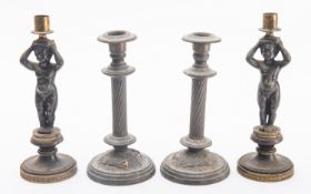 A pair of Regency parcel gilt bronze figural candlesticks,