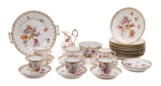 A composite Dresden porcelain part tea service comprising six cups, eight saucers, milk jug,