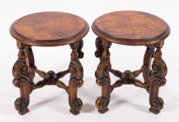 A pair of Continental walnut circular stands,