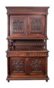 A substantial Victorian oak side cabinet in Gothic taste,
