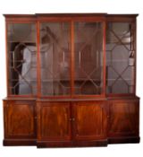 A mahogany and glazed breakfront bookcase in George III style,
