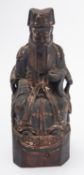 A Chinese carved wood and polychromed wood figure of a seated dignitary, 17th/18th century,