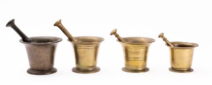 A bronze mortar, 18th century; of tapered form with flared rim and spreading foot, 11cm high,