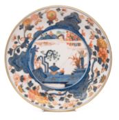 A First Period Worcester saucer dish painted in Japanese style with a central lake landscape