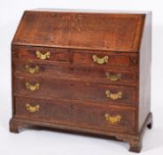 A George III oak and walnut banded bureau,