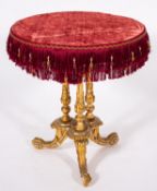 A giltwood, composition and velvet topped circular occasional table, in Rococo Revival style,