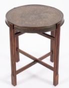 A near Eastern pressed brass and stained wood occasional or 'tiffin' table, retailed by Mosq,