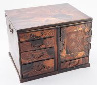 A Japanese parquetry Kodansu, Meiji period one side with four graduated drawers,