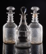 A pair of decanters profusely cut with diamonds, with stepped shoulders,