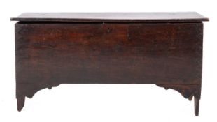 An oak 'six plank' coffer, 17th century; the hinged cover with channeled front,