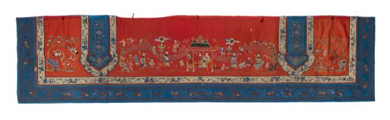A Chinese silk wall hanging worked in coloured threads with ladies at leisure in a garden pavilion