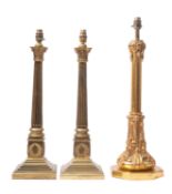 A pair of brass columnar table lamps, 20th century; the electrical fitments on Composite capitals,