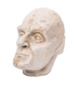 A stoneware pottery Death Mask of an elderly man, covered in a bluish cream glaze,