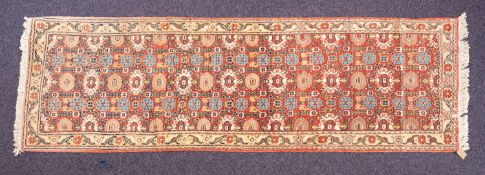 An Erivan runner, the brick red field with an all over geometric design,