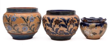 A Doulton Lambeth jardiniere and two Royal Doulton jardinieres,