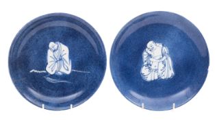 A matched pair of Chinese powder blue ground saucer dishes,