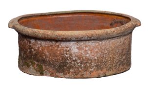 A terracotta salting pan or bacon trough, latterly utilised as a jardiniere,