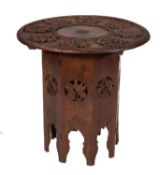 An Indian carved hardwood occasional table,