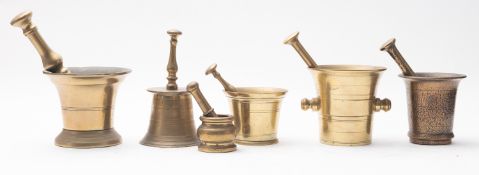 A group of six brass mortars and pestles,