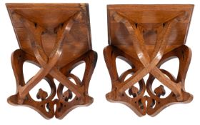 A pair of Victorian oak corner brackets,