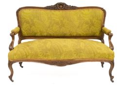 A carved and parcel gilt walnut three piece salon suite, in Louis XV taste,