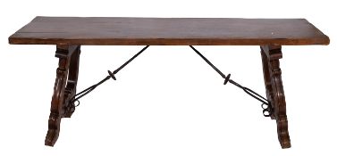 A Spanish walnut and wrought iron mounted refectory table in 17th Century style;
