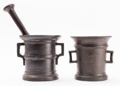 A cast iron mortar, probably Austro-German, early 18th century; of cylindrical form with flared rim,