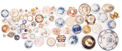 An accumulation of primarily porcelain covers, stoppers and lids, domestic, European and Chinese,