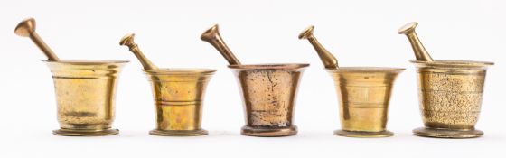 An English brass mortar, late 18th /early 19th century; of tapering form, with flared rim,