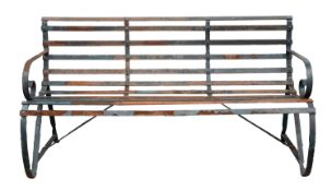 A painted wrought iron garden bench, 20th century; of slatted strapwork form,