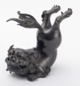 A Chinese bronze mythical beast censer and cover, 17th/18th century modelled as a leaping lion-dog,