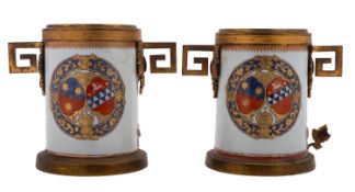 A pair of Chinese armorial ormolu-mounted vases, the porcelain Qing Dynasty, circa 1720,