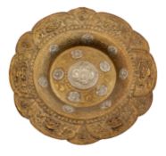 A large Sino-Tibetan brass and silver repoussé wall charger,