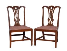 A pair of George III mahogany side chairs,