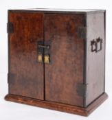 A Chinese elm and metal bound table cabinet,