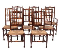 A set of eight stained hardwood and rush seated spindle back chairs, in 18th century style;