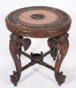 An Indian carved and stained hardwood and ivory mounted circular occasional table,
