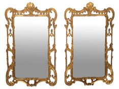 A pair of George III carved and giltwood framed wall mirrors,