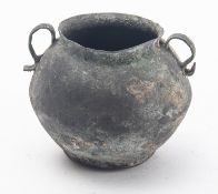 A copper alloy twin handled jar, perhaps Romano British, of squat form,