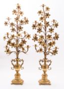 A pair of gilt metal eight light candelabra in late 18th century taste,