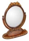 A rosewood and parcel gilt dressing table mirror in Regency style,