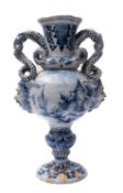 A Delft pottery footed vase with lobed flaring neck with entwined serpent handles and Bacchus masks