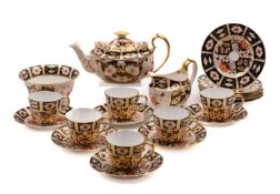 A Royal Crown Derby 'Imari' tea service decorated in pattern 2451, pink 'Bone China' marks,