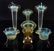 A Tiffany Favrille iridescent glass small ribbed bowl; a similar pedestal compote cup;