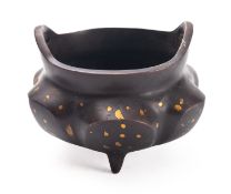 A Chinese gold splash bronze 'lotus' tripod censer apocryphal four-character Xuande mark, 11cm.
