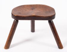 A Victorian oak milking stool,