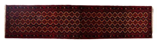 A Turkoman runner, the shaded field with an all over serrated lozenge design,